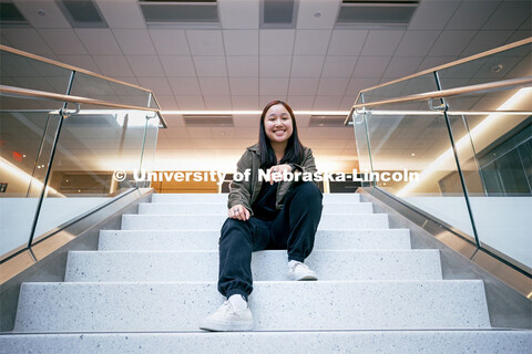 Kiley Pham, a Junior Civil Engineering Major, poses at the top stairwell in Kiewitt Hall as a featur