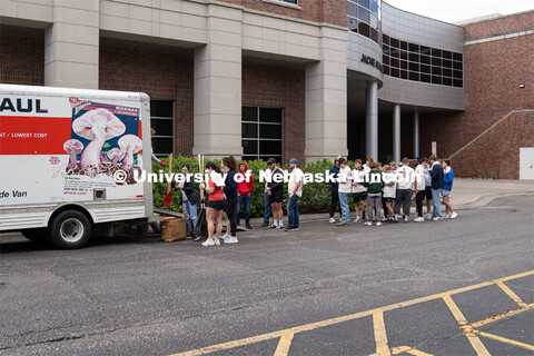 Big Event student volunteers line up at gear checkout truck to get tools for the day. May 4, 2024. 