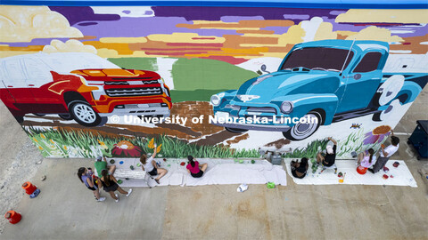 High angle view of students painting a mural. ARTS 398 - Special Topics in Studio Art III taught by 