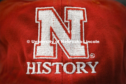 Nebraska History ballcap. Students in Research Experiences for Undergraduates research old documents