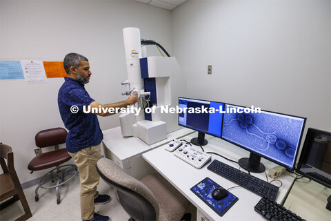 Bara Altartouri, a post-doc research associate in the Center for Biotechnology, looks over an image 