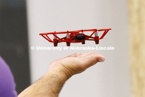 A small UAV lands on the hand of Brandon Mowinkel, a teacher at Milford Public Schools. Travis Ray f