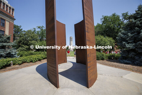 The Greenpoint sculpture frames the Mueller Bell Tower on City Campus. July 11, 2024. 