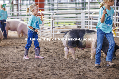 Ivy Mentink, 5, shows off her Clover Kids ribbon to family and friends. 4-H Polk County Fair in Osce