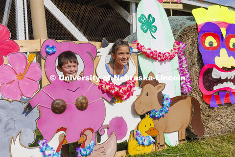 Kids pose for a photo op at the painted animal backdrop. 4-H Polk County Fair in Osceola, Nebraska. 