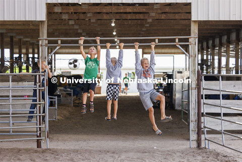 Three young boys just hanging around at the 4-H Polk County Fair in Osceola, Nebraska. July 19, 2024