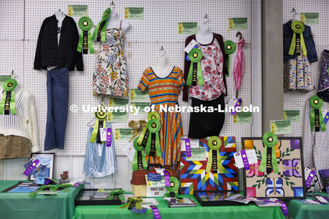 Ribbons adorn the clothing exhibit entries. 4-H Polk County Fair in Osceola, Nebraska. July 19, 2024