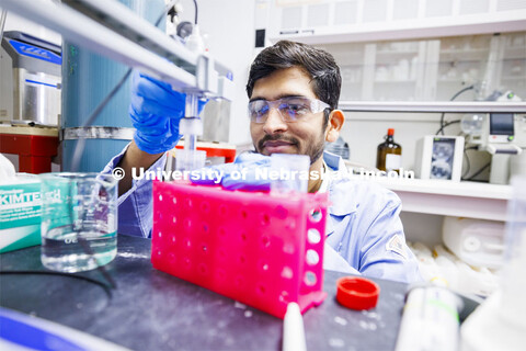 Amit Barsiwal adjusts a device to change the ph balance of a fluid. chemistry lab. James Checco Hami