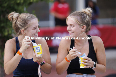 Elizabeth and Danica McNatt of Omaha enjoy Kona Ice at the Block Party at Harper Schramm Smith resid