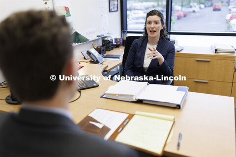 Lecturer Liz Cole talks with a law student in the Innocence Clinic. College of Law Clinics. Septembe