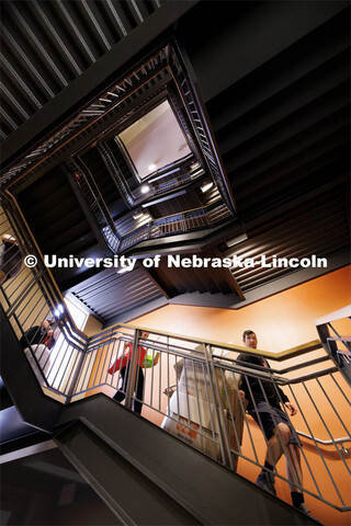 Bailey Dieckmann’s family heads down the stairs in Knoll Residence Hall with the cardboard remains