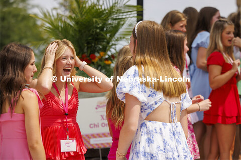 Sorority compare experiences while waiting outside the Chi Omega sorority during Wednesday’s Phila