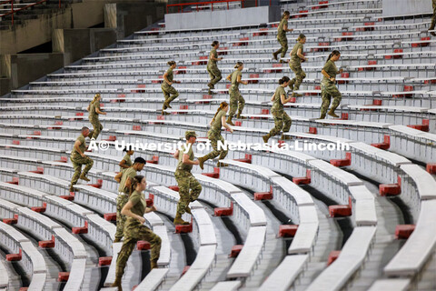 Army ROTC cadets climb the steps in west stadium. 9/11 stair climb in Memorial Stadium to commemorat