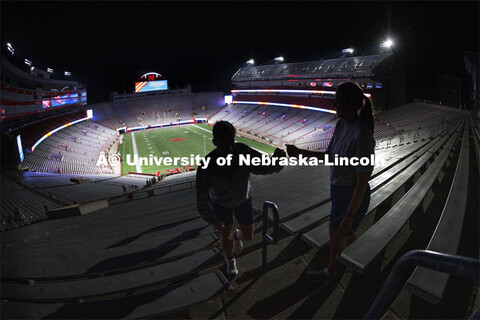 Air Force ROTC cadets give each other fist bumps as they reach the top of south stadium. 9/11 stair 