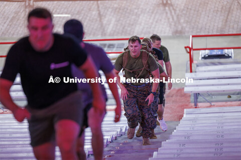 Marine and Navy Midshipmen climbs the steps in east stadium. 9/11 stair climb in Memorial Stadium to