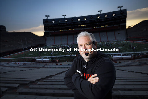 Doug Bush, Assistant Director of Bands, directs the band’s formations while standing in the west s