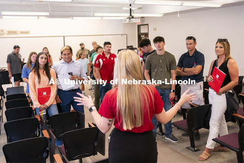 High school students and parents look inside an Avery Hall classroom during Red Letter Day. Septembe