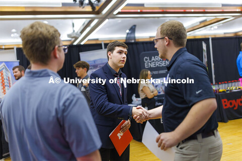 Sean Radke, a sophomore in Mechanical Engineering, talks with recruiters from HOA Solutions. Career 