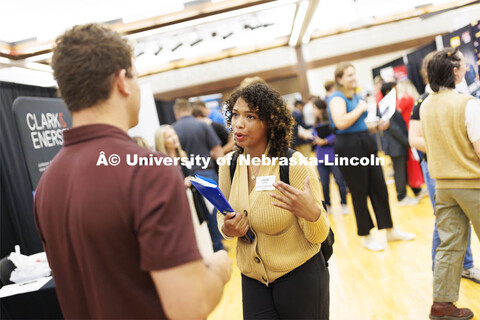 Jaeda Jeffries, a junior in Construction Management, talks with Alex Masek of Brinkman Constructors 