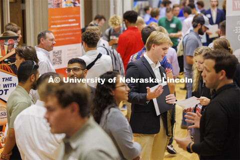 Mason Moore, a senior in Chemical Engineering, discusses his resume with a recruiter during the Care