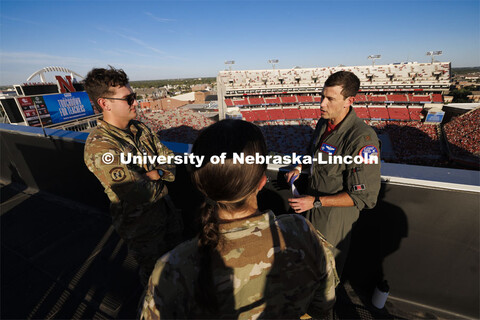 From atop the west stadium roof, Air National Guard Major Bobby Sullivan with the 175th fighter squa