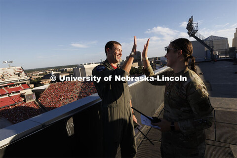 From atop the west stadium roof, Air National Guard Major Bobby Sullivan with the 175th fighter squa