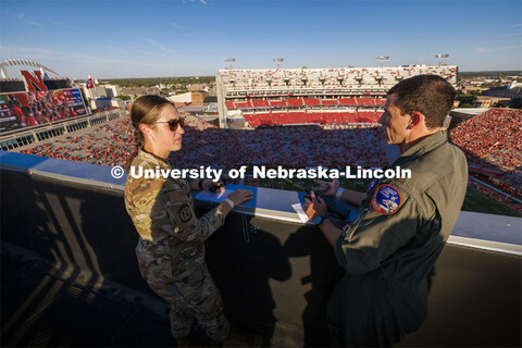 From atop the west stadium roof, Air National Guard Major Bobby Sullivan with the 175th fighter squa