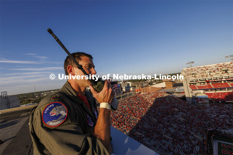 From atop the west stadium roof, Air National Guard Major Bobby Sullivan with the 175th fighter squa