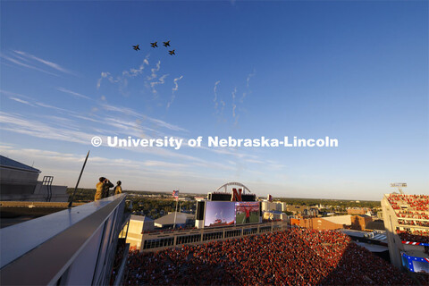 From atop the west stadium roof, Air National Guard Major Bobby Sullivan with the 175th fighter squa