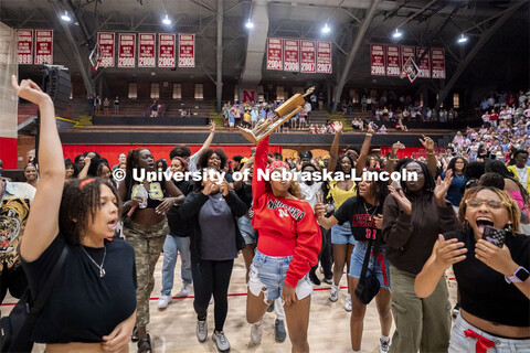 Afrikan Peoples Union president Mariah May raises the first place trophy after winning Showtime. Sho