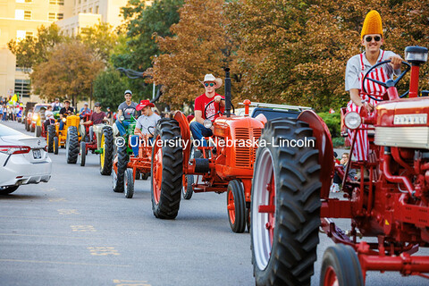 The Tractor Restoration Club participates in the 2024 Homecoming Parade with one member decked out i