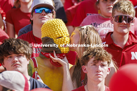 Ryan Jensen gets a kiss from his girlfriend, Emmy Oldham. Jensen a senior from Lincoln, wore his own