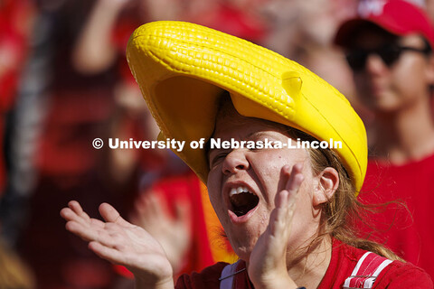 Sarah Person cheers in a more traditional corn head. Nebraska vs Rutgers football game. Homecoming g