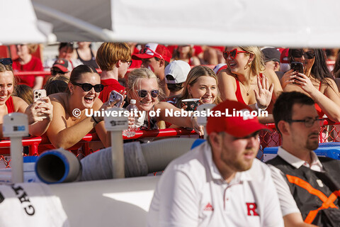 Fans snap pictures on their phones at the Nebraska vs Rutgers football game. Homecoming game. Octobe