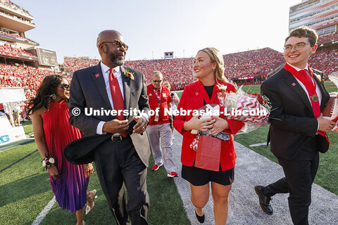 Chancellor Rodney D. Bennett, his wife, Temple (left) and homecoming royalty Emmerson Putnam, biolog