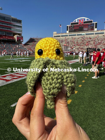 A tiny ear of corn head knitted by Emmy Oldham of Wellfleet, Nebraska. Nebraska vs Rutgers football 