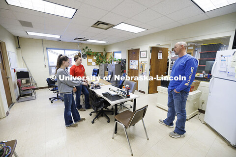 Breanna Gilmore and McKenna Carr talk with animal science research manager Brent Johnson about the d