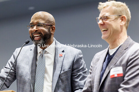 Chancellor Rodney Bennett recognizes Assistant Vice Chancellor James Volkmer inside the Willa Cather