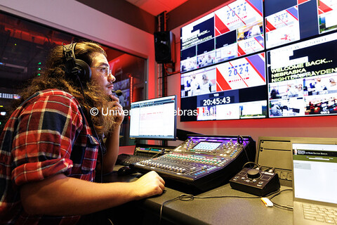 Sophomore Nathan Ertzner monitors audio during the Nebraska Nightly election broadcast inside Anders