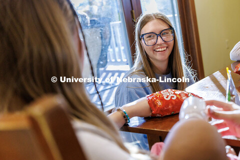 Lighthouse's volunteer and community outreach coordinator and UNL alumna, speaks with students insid