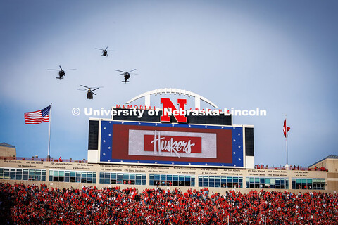 Military helicopters do a flyover at the Huskers vs. Wisconsin football game. November 23, 2024. 