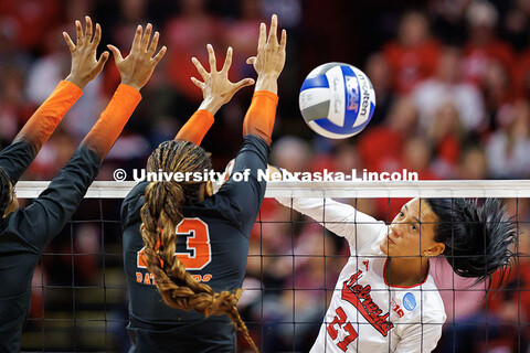 Nebraska’s Harper Murray (right) spikes the ball during round one of the NCAA Volleyball Tournamen