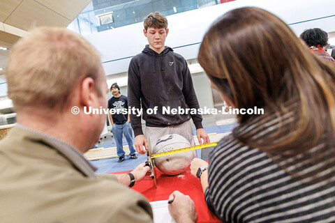 Mason Whitmore, junior, watches as his team’s ball is measured by judges during the Concrete Bowli