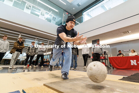 Vinny Bui, sophomore, throws his ball down the lane during the Concrete Bowling Competition at the K