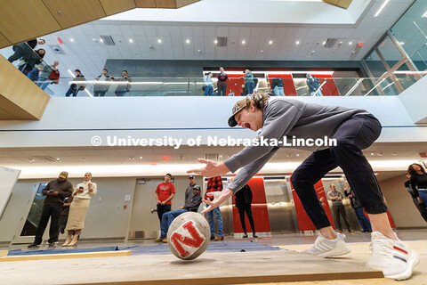 Quinn Gossett, junior, rolls his ball down the lane with enthusiasm during the Concrete Bowling Comp