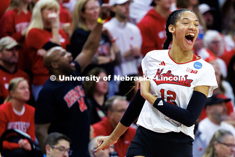 Nebraska’s Taylor Landfair celebrates after blocking the ball to score a point during the NCAA Vol