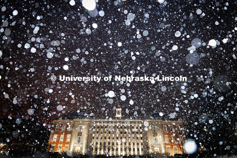 Snow falls onto Love Library. Snow on City Campus. January 4, 2025. 