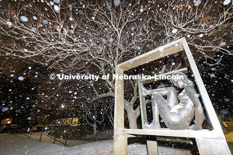 Snow falls onto the bronze sculpture ‘SANDY: In Defined Space’ outside of Woods Art Building. Sn