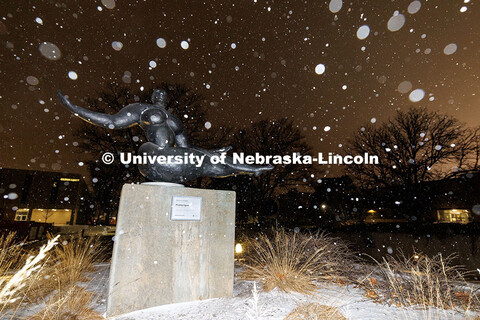 Snow falls onto ‘Floating Figure’ outside of the Sheldon Museum of Art. Snow on City Campus. Jan