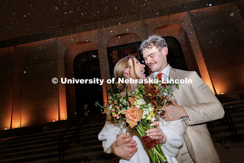 2024 alum Rachel Swanson takes advantage of the snow by taking photos with her newly-wed husband Luk